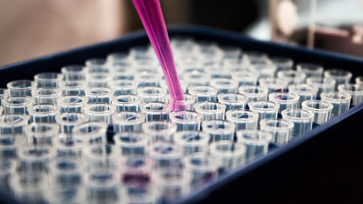 Laboratory tray of test tubes with a pipette transferring a sample.
