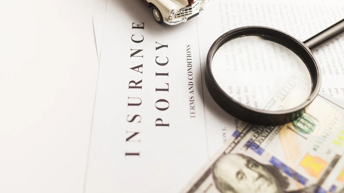 Magnifying glass resting on an insurance policy and financial documents.
