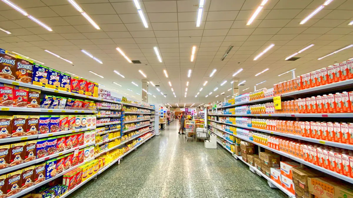 Well-stocked retail grocery aisles with shelves of consumer products.