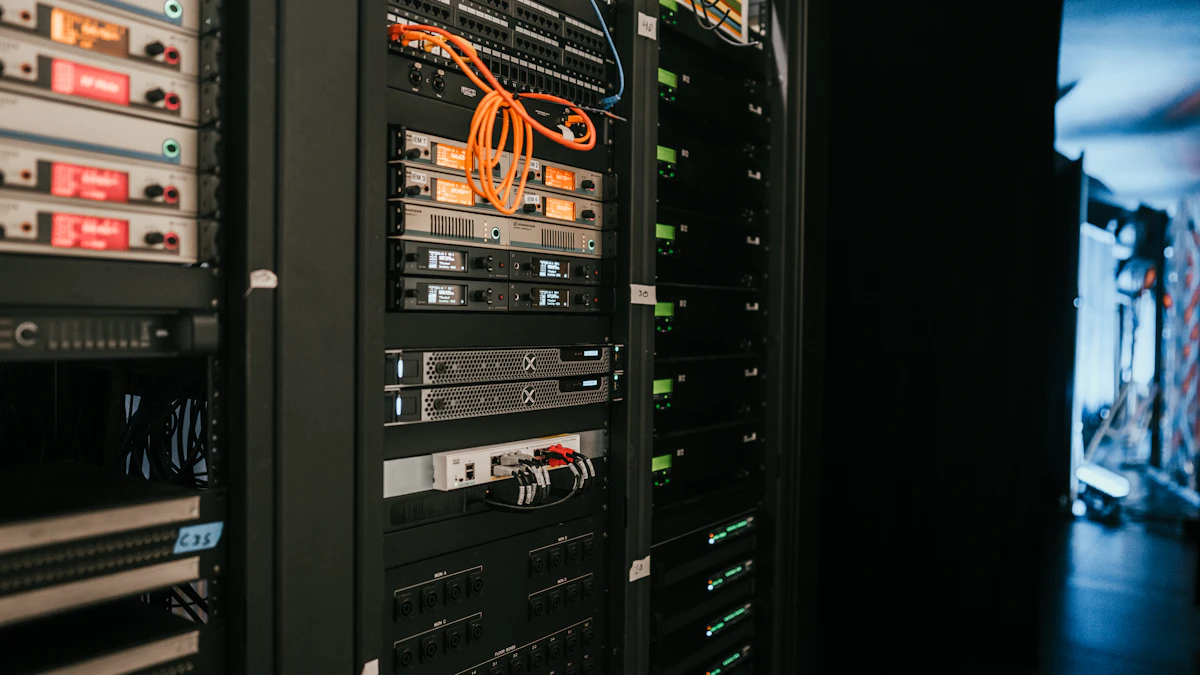 Server racks with network cabling and status lights in a data center.
